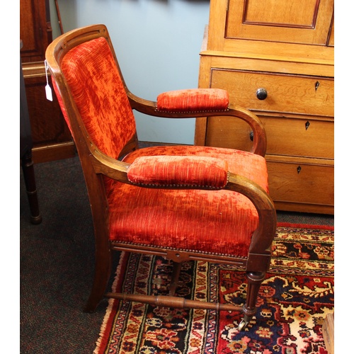 738 - A Victorian oak and upholstered library chair, the padded back within a fluted frame, above down swe... 