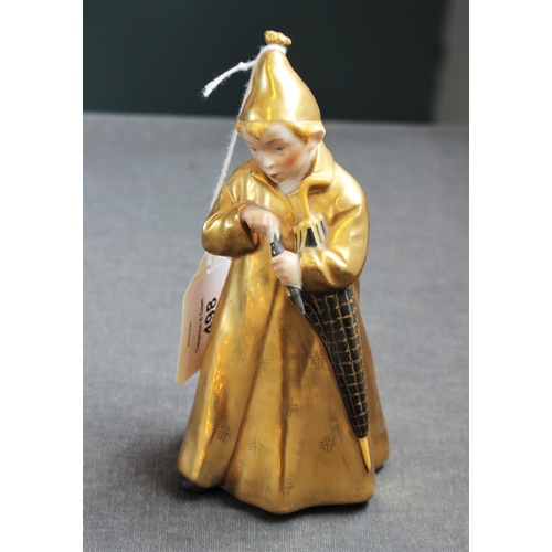 498 - A Royal Copenhagen figure 'The Sandman' model number 1145, with gilt coat and hat, 16cm high