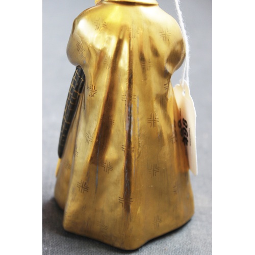 498 - A Royal Copenhagen figure 'The Sandman' model number 1145, with gilt coat and hat, 16cm high