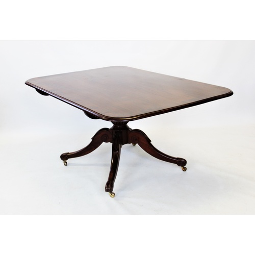 749 - An early 19th century mahogany breakfast table, the rectangular cross banded tilt top with rounded c... 