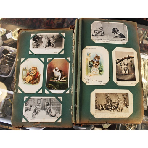 279 - A collection of Edwardian postcards to an album to include topographical interest, greetings cards t... 