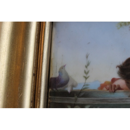 268 - A French enamelled porcelain plaque, after Laure Levy, 'Young Love', indistinctly signed 'M Luce', 2... 