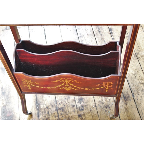 391 - An Edwardian, Regency style inlaid mahogany freestanding book trough, the trough above a single shel... 