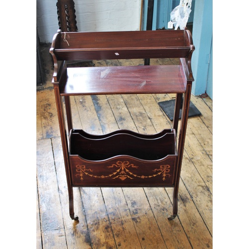 391 - An Edwardian, Regency style inlaid mahogany freestanding book trough, the trough above a single shel... 