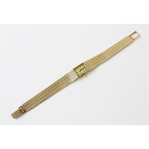 119 - A lady's vintage 9ct gold Omega wristwatch, comprising a rectangular gold toned dial with baton mark... 