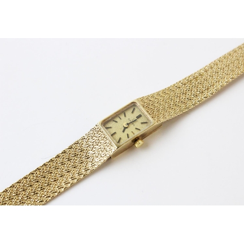 119 - A lady's vintage 9ct gold Omega wristwatch, comprising a rectangular gold toned dial with baton mark... 