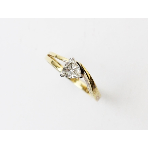 125 - A diamond solitaire ring, comprising a central trilliant cut diamond, width 5mm, length 5mm, claw se... 