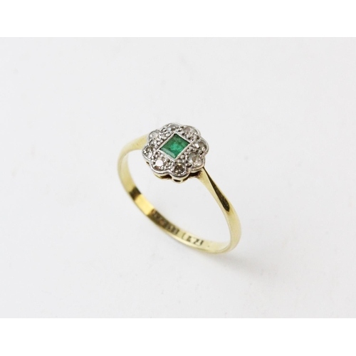 126 - An early 20th century emerald and diamond ring, comprising a central rectangular step cut emerald wi... 