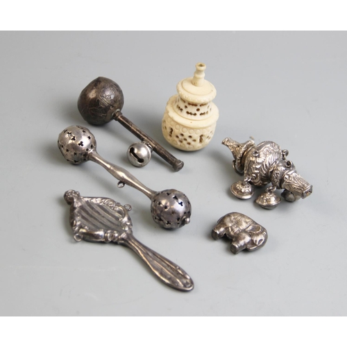 60 - A collection of assorted child's rattles and accessories, to include a 19th century child's whistle ... 