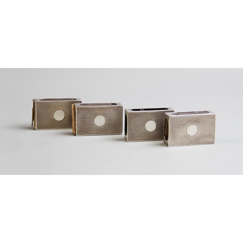 66 - A set of four silver matchbox sleeves, Cohen & Charles, London 1934, each with engine turned detail ... 