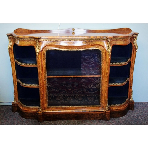 662 - A Victorian burr walnut credenza, the shaped moulded top with satinwood cross banding, above a gilt ... 