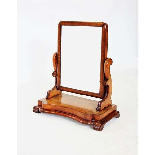 671 - A Victorian mahogany dressing table mirror, of rectangular form on curvilinear supports and a concav... 