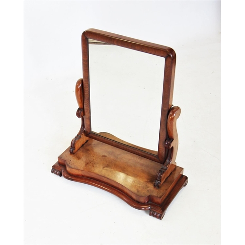 671 - A Victorian mahogany dressing table mirror, of rectangular form on curvilinear supports and a concav... 