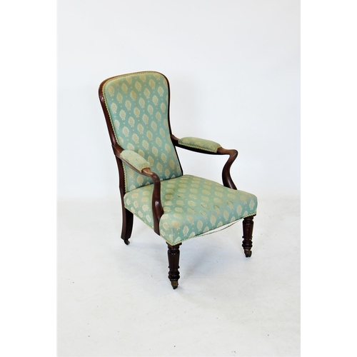 672 - A William IV mahogany framed open armchair, the padded spoon back with a mahogany frame extending to... 