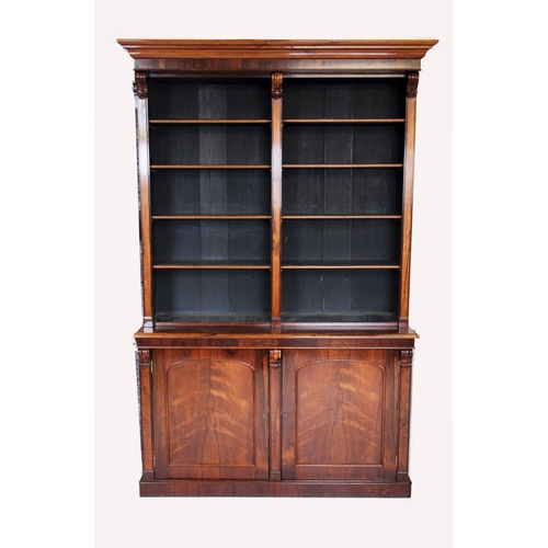 677 - A mid 19th century rosewood library open bookcase, with a cavetto cornice above a plain frieze and e... 