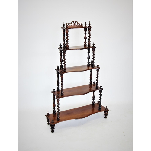 678 - A Victorian rosewood what not, with five graduated serpentine tiers, the upper tier with an openwork... 