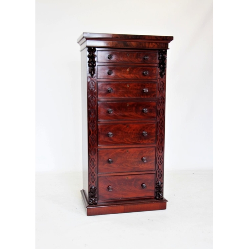 680 - A mid 19th century mahogany Wellington chest, the rectangular top above seven graduated and cock bea... 