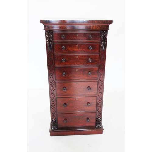 680 - A mid 19th century mahogany Wellington chest, the rectangular top above seven graduated and cock bea... 