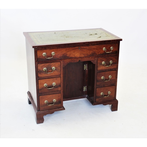 685 - A 19th century mahogany knee hole desk, the rectangular top with an inset leather writing surface, a... 