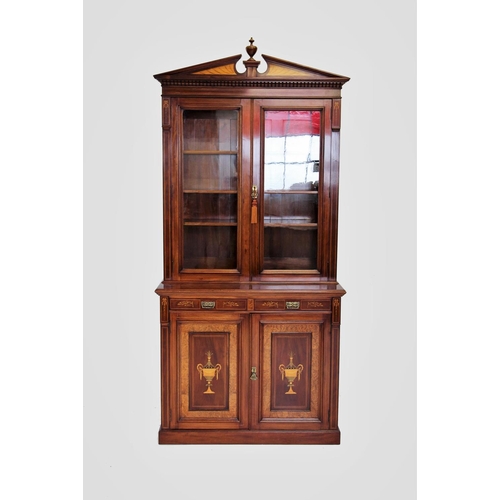 704 - An Edwardian Sheraton revival mahogany library bookcase, the architectural pediment inlaid with sati... 