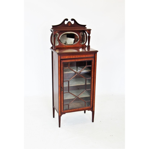 712 - An Edwardian mahogany music cabinet, the raised architectural back with a twin swan neck pediment ab... 