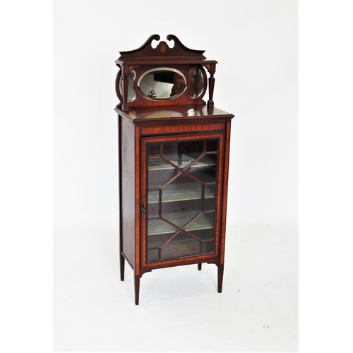 712 - An Edwardian mahogany music cabinet, the raised architectural back with a twin swan neck pediment ab... 