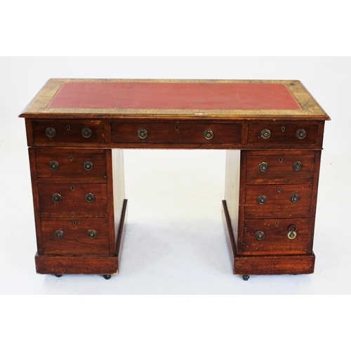 713 - An early 20th century oak twin pedestal desk, with a leather inset top above three frieze drawers, r... 