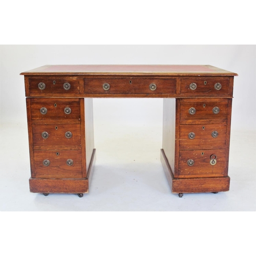 713 - An early 20th century oak twin pedestal desk, with a leather inset top above three frieze drawers, r... 