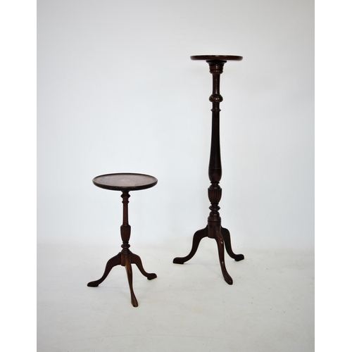 718 - A 19th century style mahogany torchere, 20th century, the circular tray top raised upon a fluted and... 