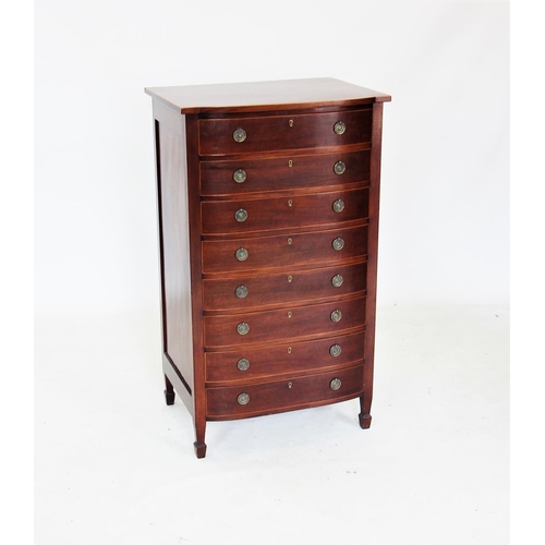 720 - An Edwardian mahogany bow front chest of drawers, the shaped top with inlaid stringing, above eight ... 