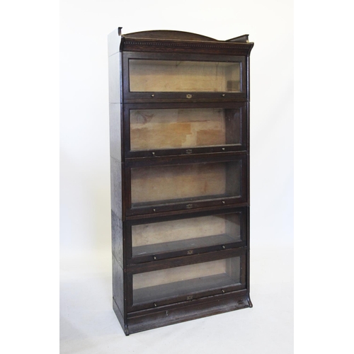 726 - An early 20th century oak five tier 'Lebus' stacking bookcase, with a tray top above five 'up and ov... 