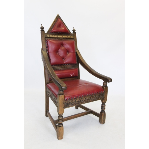 732 - A Queen Elizabeth II Silver Jubilee 1977 carved oak and red leather throne chair, modelled on the co... 