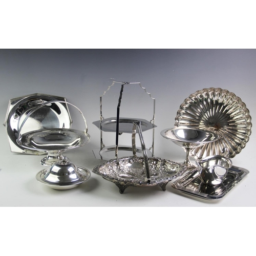 76 - A collection of silver plated serving wares, to include; a Victorian silver swing-handled cake baske... 