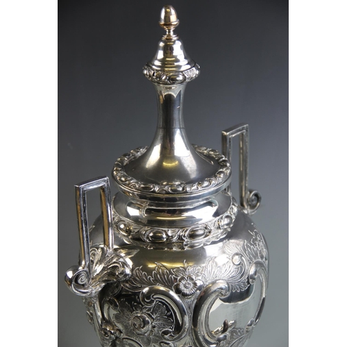 81 - A silver plated samovar, late 19th/early 20th century, of urn form, with relief cast floral and foli... 