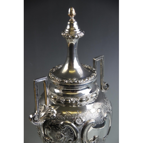 81 - A silver plated samovar, late 19th/early 20th century, of urn form, with relief cast floral and foli... 