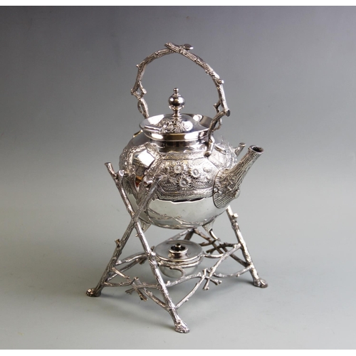 82 - A silver plated Aesthetic movement spirit kettle, early 20th century, the kettle with cast naturalis... 