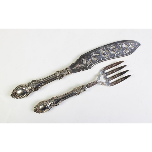 83 - A pair of Victorian silver fish servers, John Gilbert, Birmingham 1859, both with moulded foliate sc... 