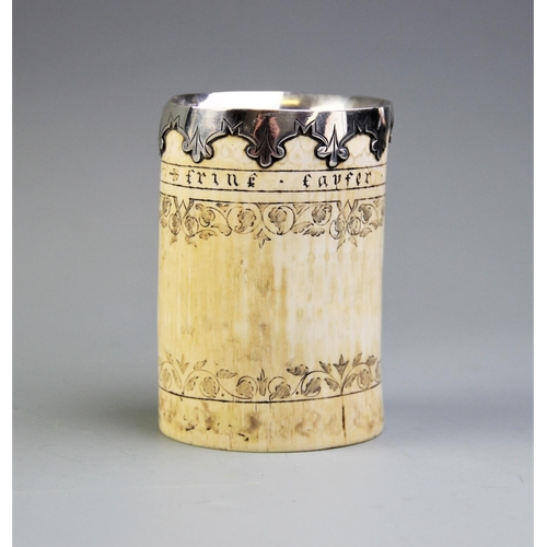 87 - A white metal mounted scrimshaw tusk pot, inscribed 'Frine favfer und fief' below the metal mounted ... 