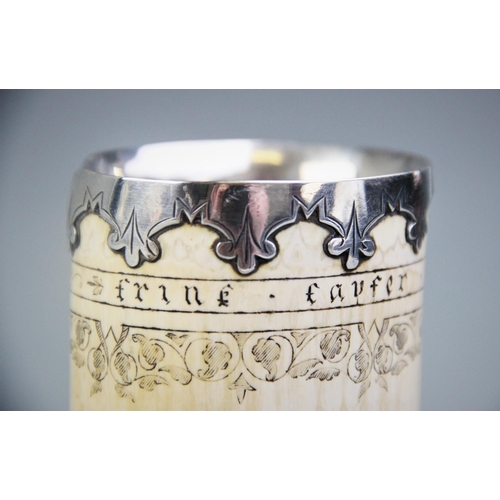 87 - A white metal mounted scrimshaw tusk pot, inscribed 'Frine favfer und fief' below the metal mounted ... 