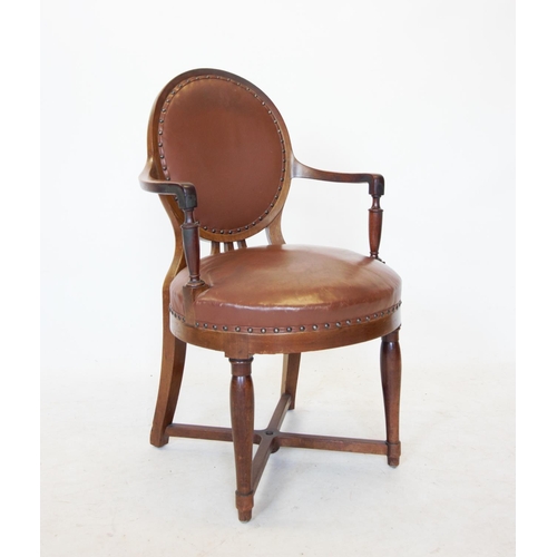 700 - A Biedermeier style mahogany elbow chair, early 20th century, with an oval leather upholstered back ... 