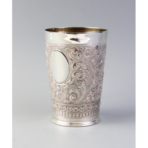 71 - A Victorian silver beaker, Henry Stratford, London 1895, of tapering cylindrical form with embossed ... 