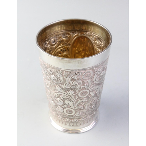 71 - A Victorian silver beaker, Henry Stratford, London 1895, of tapering cylindrical form with embossed ... 