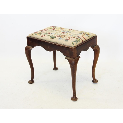 724 - An early 20th century Queen Anne style walnut dressing stool, the rectangular tapestry top raised up... 