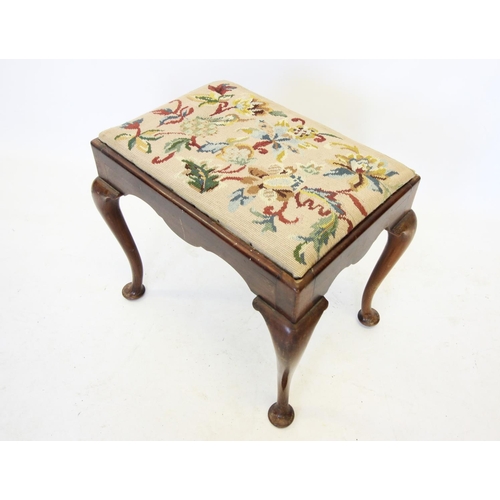 724 - An early 20th century Queen Anne style walnut dressing stool, the rectangular tapestry top raised up... 