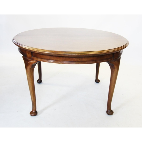 731 - An early 20th century mahogany extending dining table, the circular moulded top raised upon cabriole... 