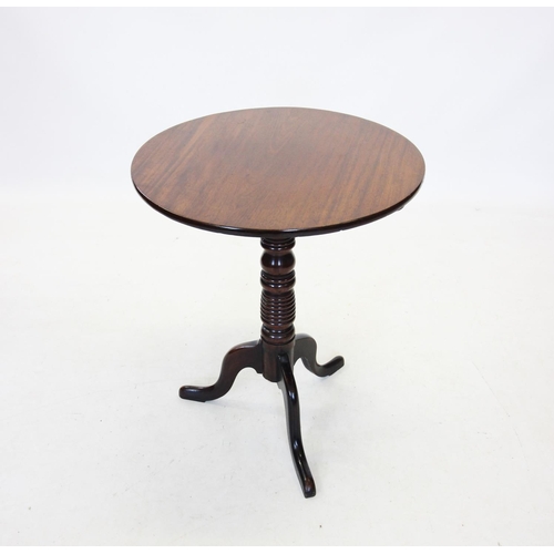 663 - A 19th century mahogany tripod lamp table, the circular top raised upon a ring turned column and thr... 