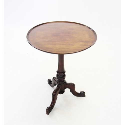 664 - A 19th century mahogany tripod lamp table, the circular tray top raised upon a fluted tapering colum... 