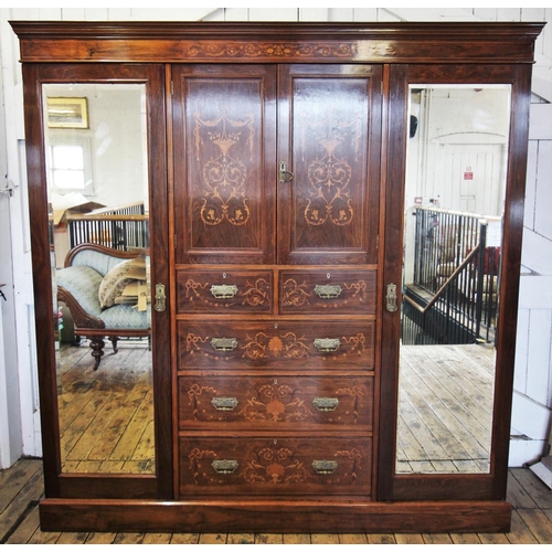 683 - A late 19th century rosewood compactum wardrobe, the moulded cornice above a frieze inlaid with scro... 