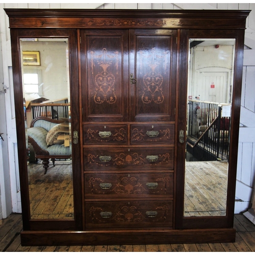 683 - A late 19th century rosewood compactum wardrobe, the moulded cornice above a frieze inlaid with scro... 