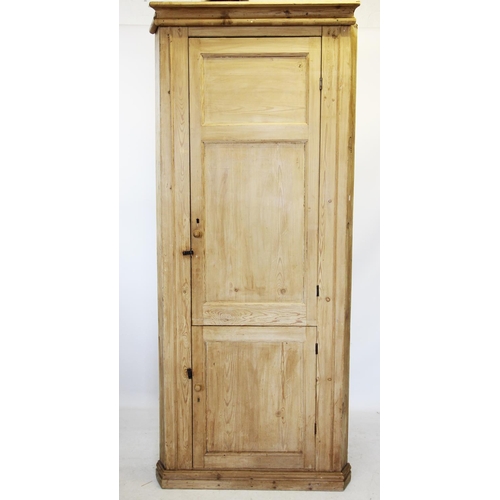 667 - A Victorian pine free standing corner cupboard, with a moulded cornice above two pairs of panelled d... 